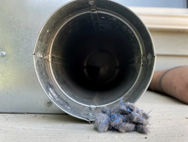 La Mirada Dryer Vent Cleaning technician using specialized equipment to clear severe dryer vent blockage in La Mirada